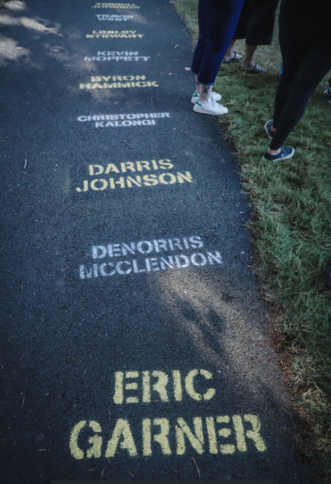 On the walking paths at Lents Park, protesters stencil the names of Black people killed by police.