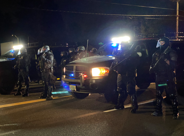 Police in full riot gear are ready and waiting to meet protesters.