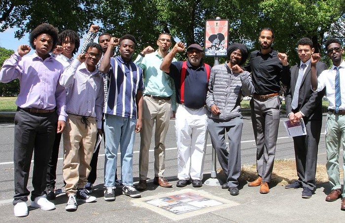 Lakayana Drury (center, light green shirt) with Word is Bond interns after a visit with Kent Ford (center, red suspenders), cofounder of the Portland chapter of the Black Panther Party.
