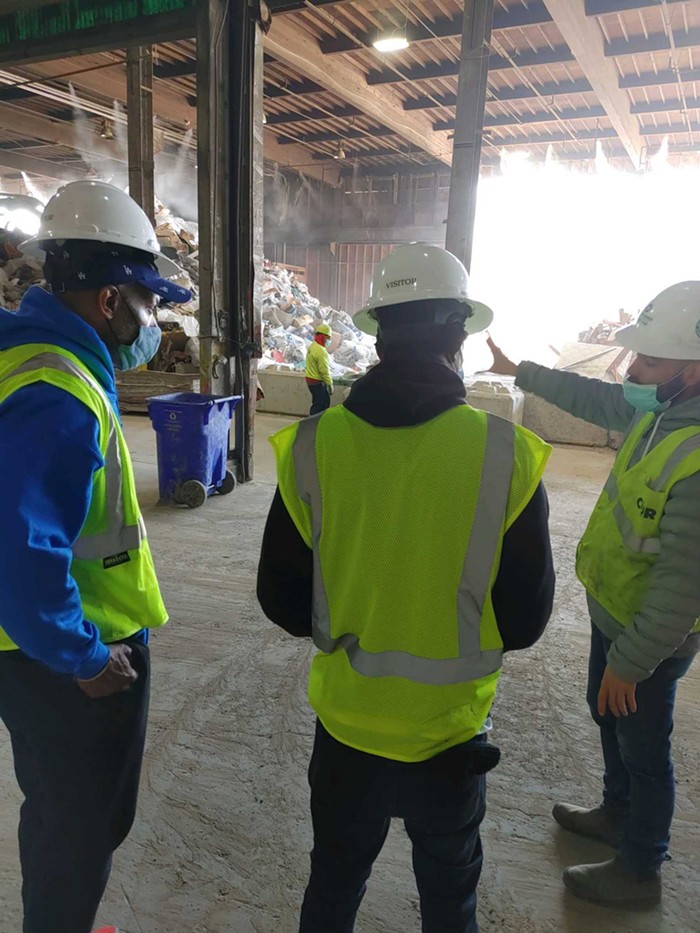 Mike Bretto Jackson and a man he mentors on a recent job orientation tour of at the City of Roses Disposal & Recycling Center