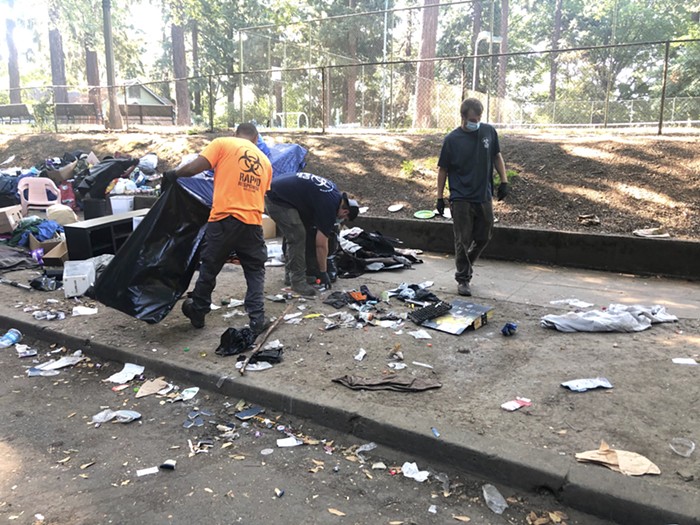 Rapid Response employees removed trash from the SE Oak encampment Thursday morning.